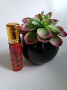 I am enough essential oil roll on with rose quartz and amethyst stones