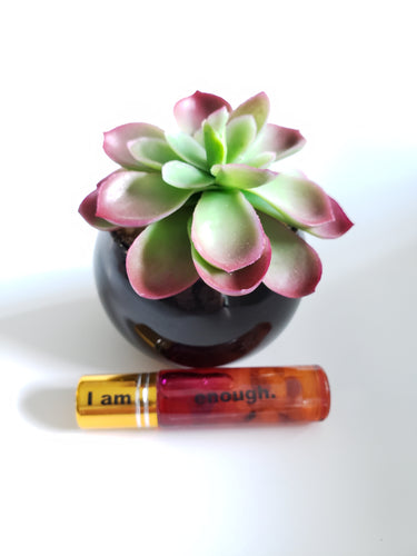 I am enough essential oil roll on with rose quartz and amethyst stones